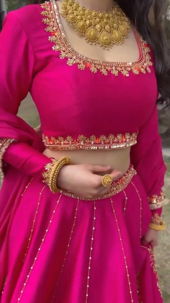 Radiant Rani Pink Silk Lehenga Choli Adorned with Opulent Heritage Floral Motifs and Intricate Zari Borders